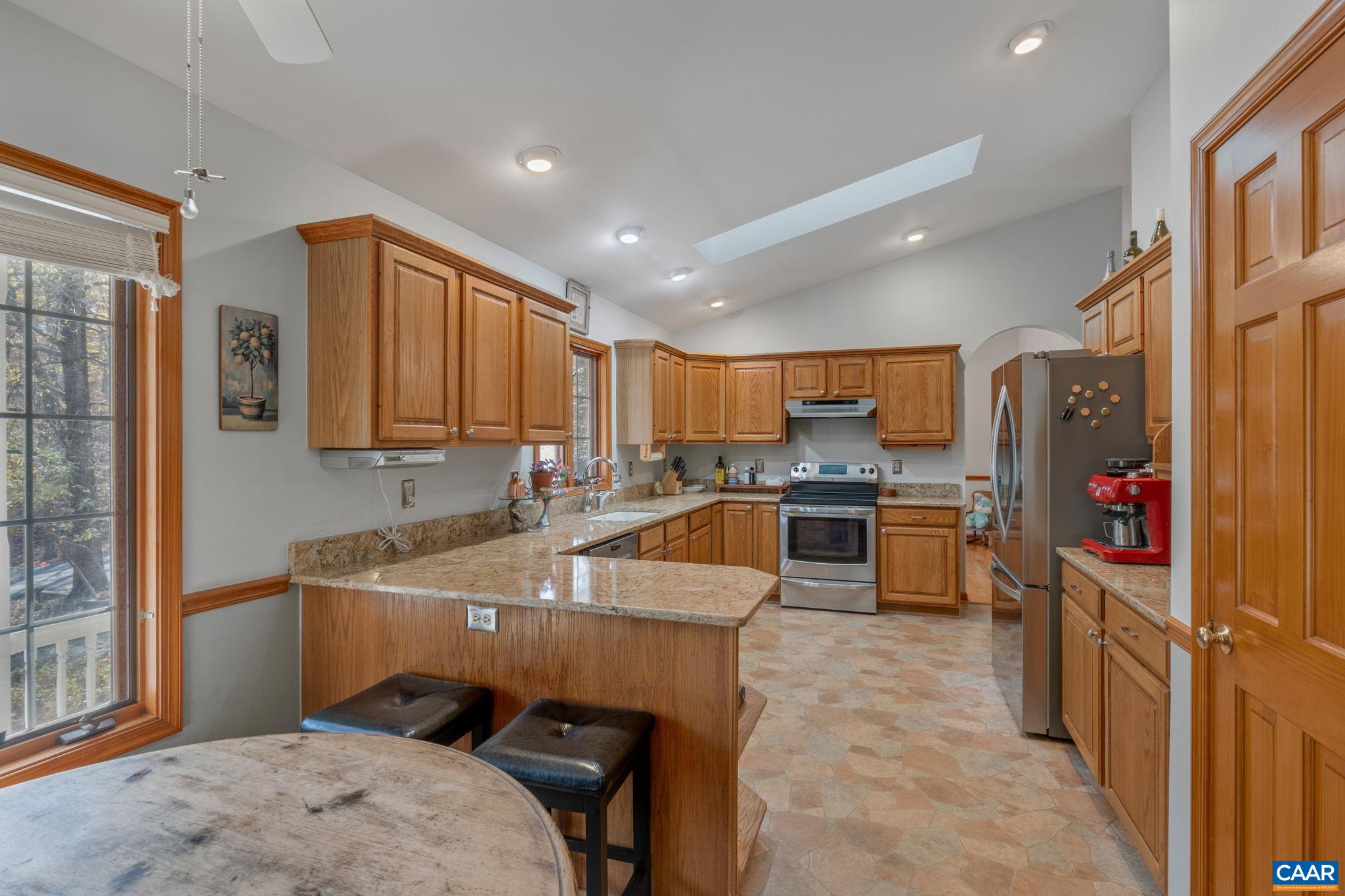 30 Brougham Road Palmyra, VA 22963 - Photo 21 of 57 a kitchen with a sink stove and cabinets