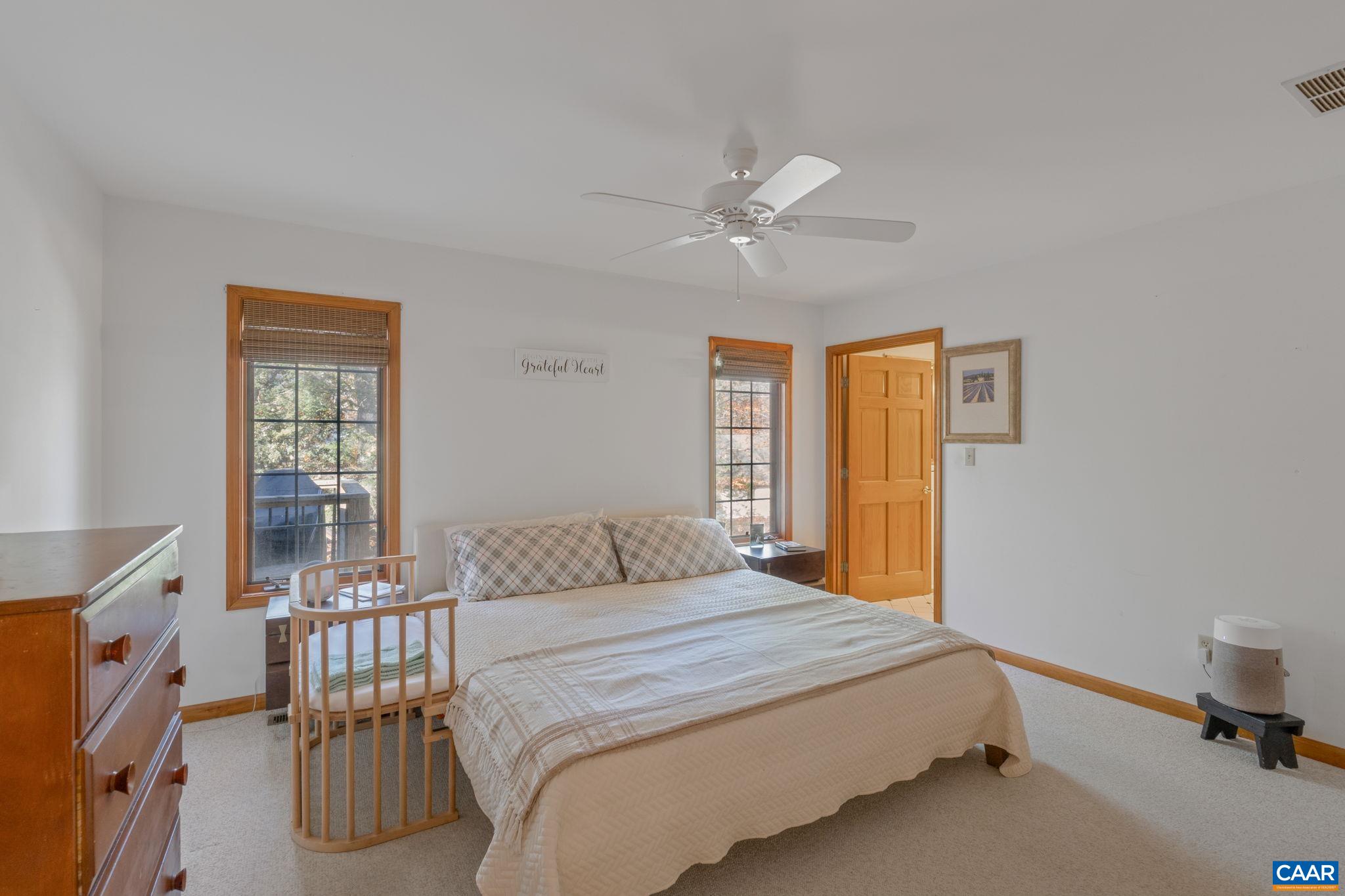 30 Brougham Road Palmyra, VA 22963 - Photo 22 of 57 a bedroom with a large bed and a window