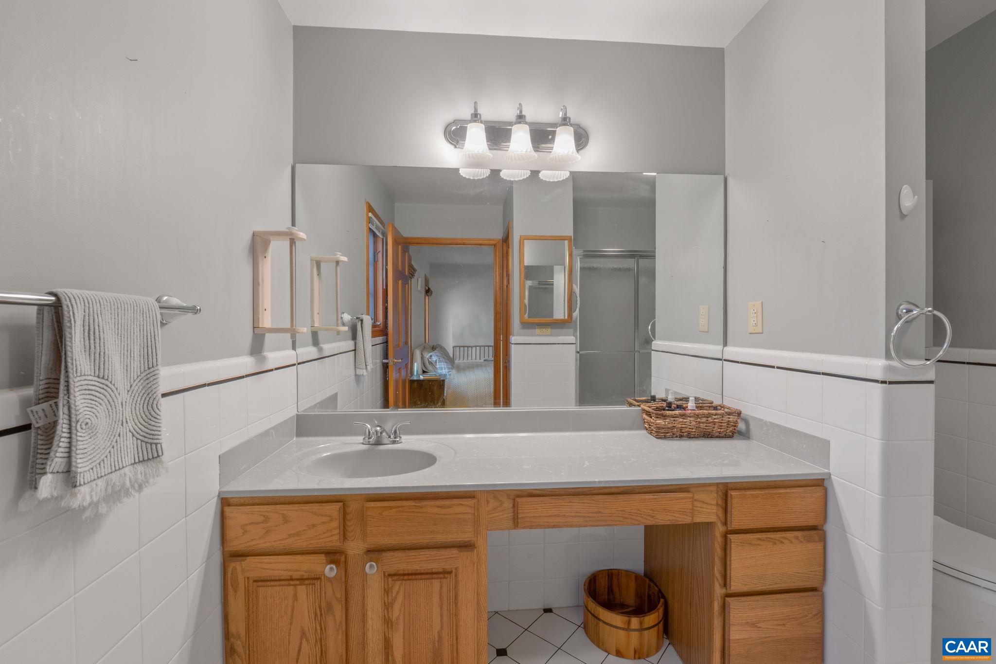 30 Brougham Road Palmyra, VA 22963 - Photo 24 of 57 a bathroom with a sink and a mirror