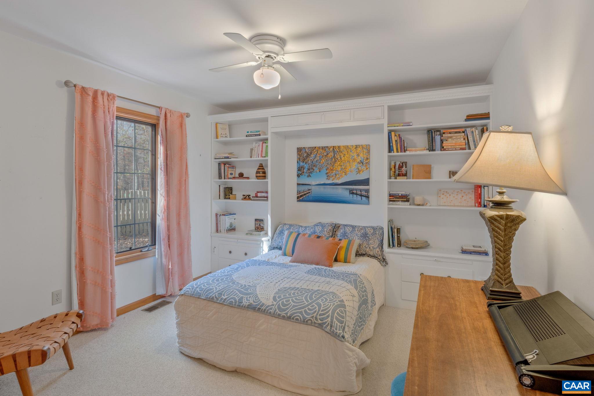 30 Brougham Road Palmyra, VA 22963 - Photo 29 of 57 a bedroom with a bed and lamp with window