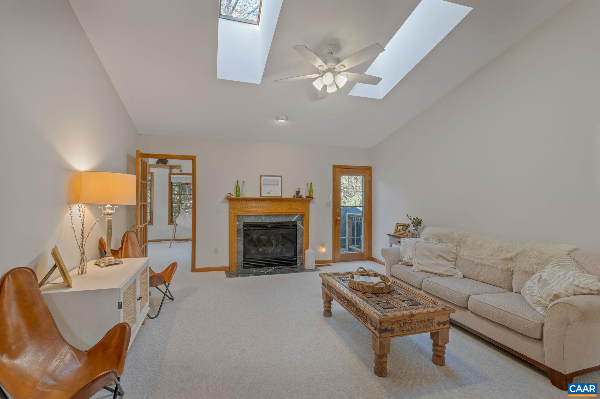 30 Brougham Road Palmyra, VA 22963 - Photo 5 of 57 a living room with furniture a fireplace and a flat screen tv