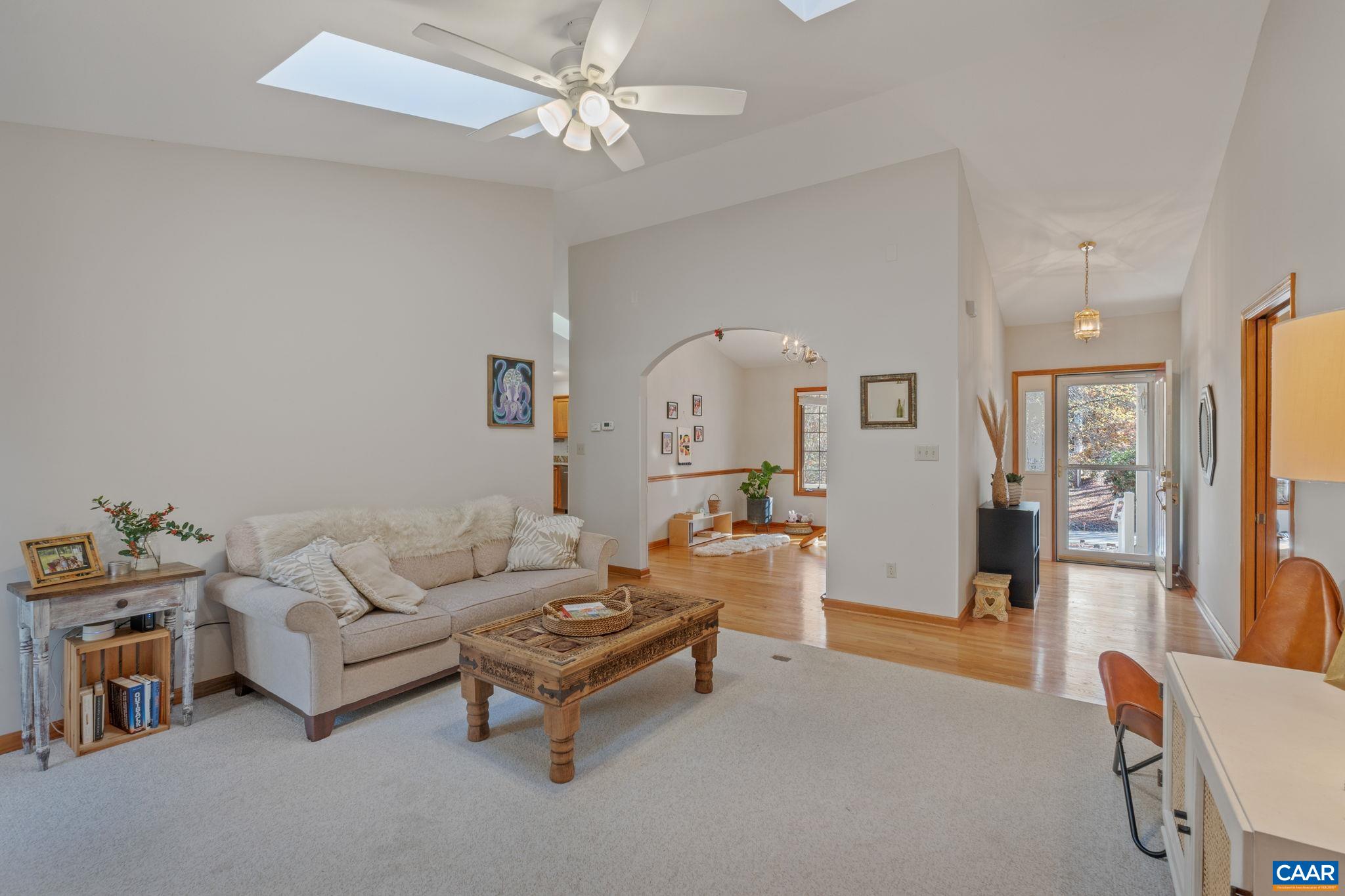 30 Brougham Road Palmyra, VA 22963 - Photo 7 of 57 a living room with furniture and a chandelier