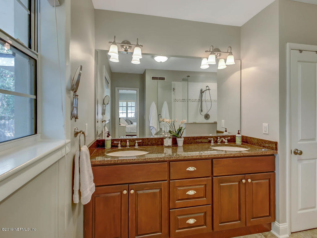 945 Mapleton Terrace Jacksonville, FL 32207 - Photo 15 of 45 a bathroom with a sink double vanity and a mirror