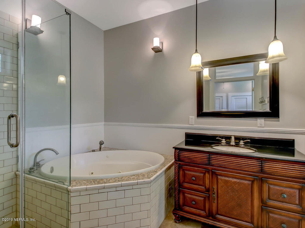 945 Mapleton Terrace Jacksonville, FL 32207 - Photo 19 of 45 a bathroom with a sink and a mirror