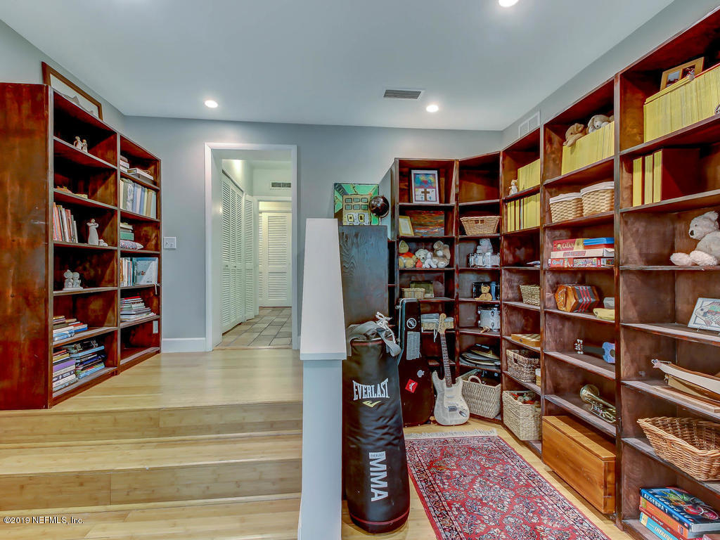 945 Mapleton Terrace Jacksonville, FL 32207 - Photo 21 of 45 a room with bookshelf and a book shelf