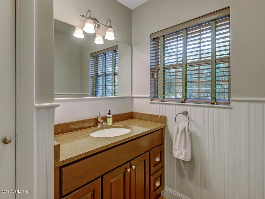945 Mapleton Terrace Jacksonville, FL 32207 - Photo 23 of 45 a bathroom with a sink and a window
