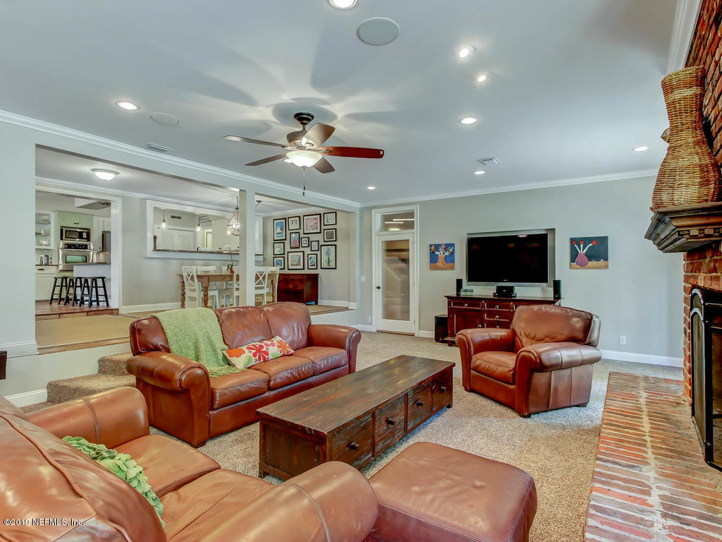 945 Mapleton Terrace Jacksonville, FL 32207 - Photo 33 of 45 a living room with furniture and a flat screen tv