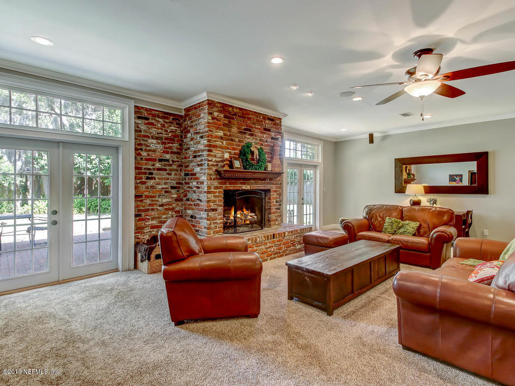 945 Mapleton Terrace Jacksonville, FL 32207 - Photo 34 of 45 a living room with furniture and a fireplace