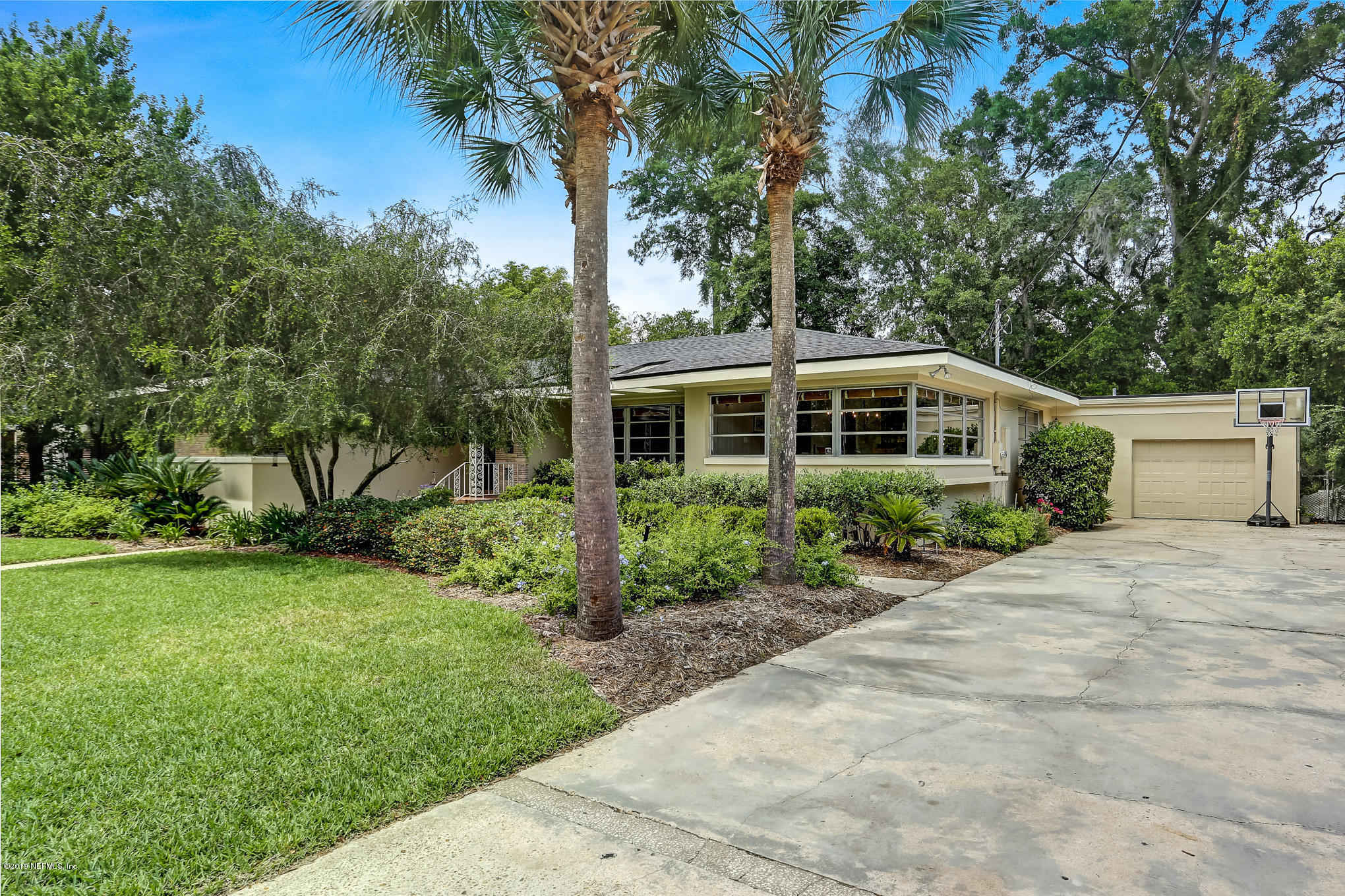 945 Mapleton Terrace Jacksonville, FL 32207 - Photo 44 of 45 a view of house with outdoor space and garden