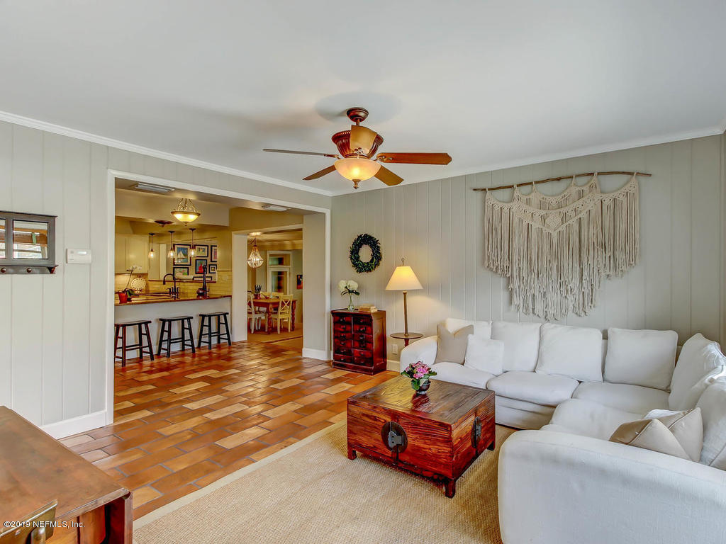 945 Mapleton Terrace Jacksonville, FL 32207 - Photo 5 of 45 a living room with furniture fireplace and a window