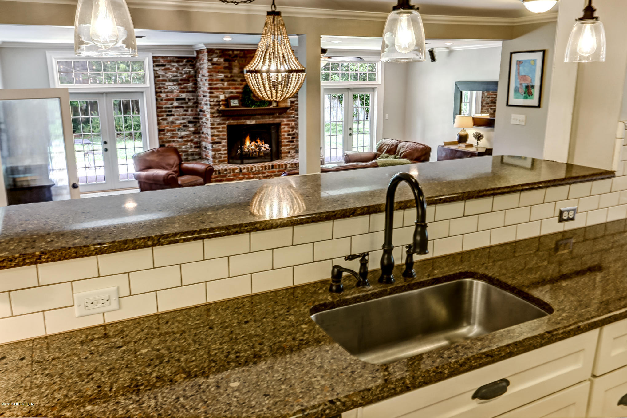 945 Mapleton Terrace Jacksonville, FL 32207 - Photo 8 of 45 a kitchen with a sink and a window