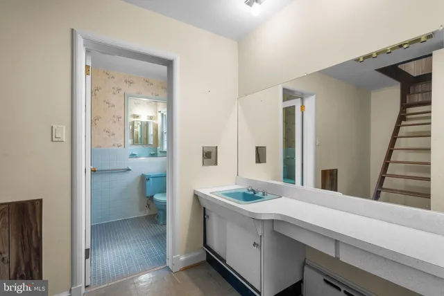 a bathroom with a double vanity sink and mirror