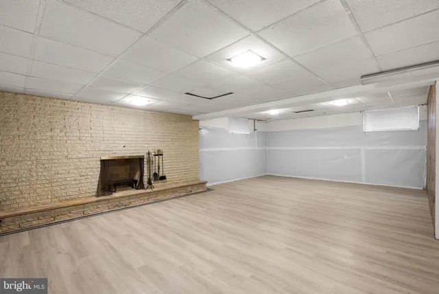 a view of an empty room with a fireplace