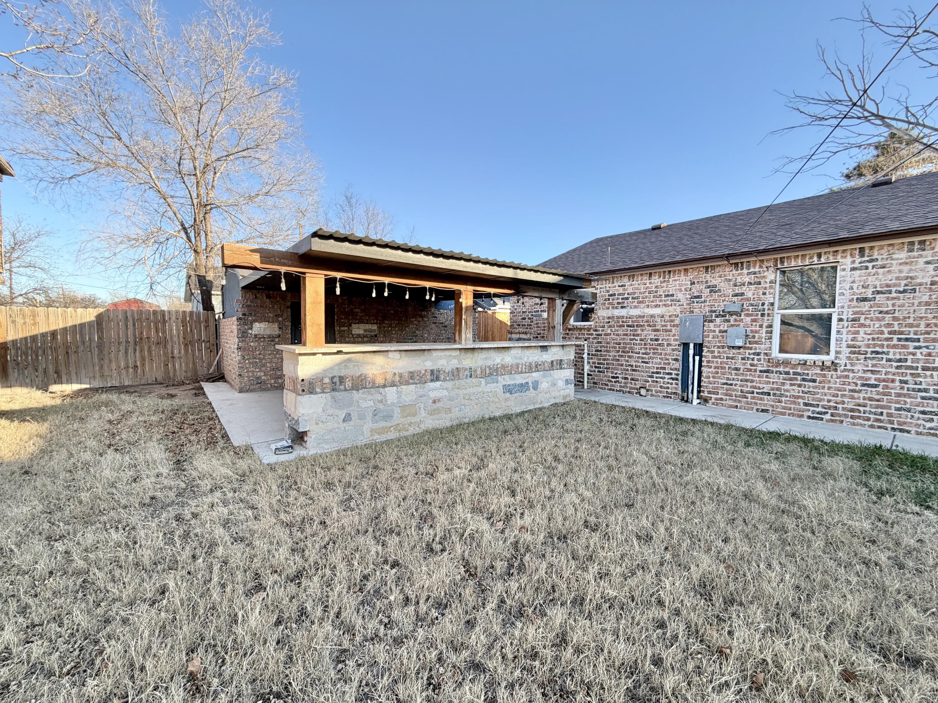 209 East 15th Street Littlefield, TX 79339 - Photo 17 of 18 a view of a house with a yard
