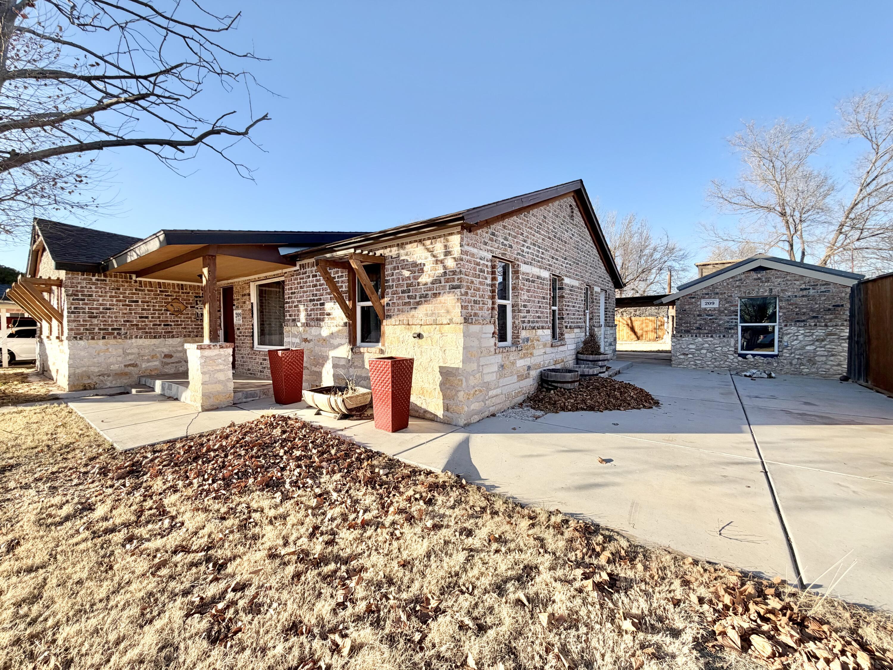 209 East 15th Street Littlefield, TX 79339 - Photo 2 of 18 a front view of a house with a snow