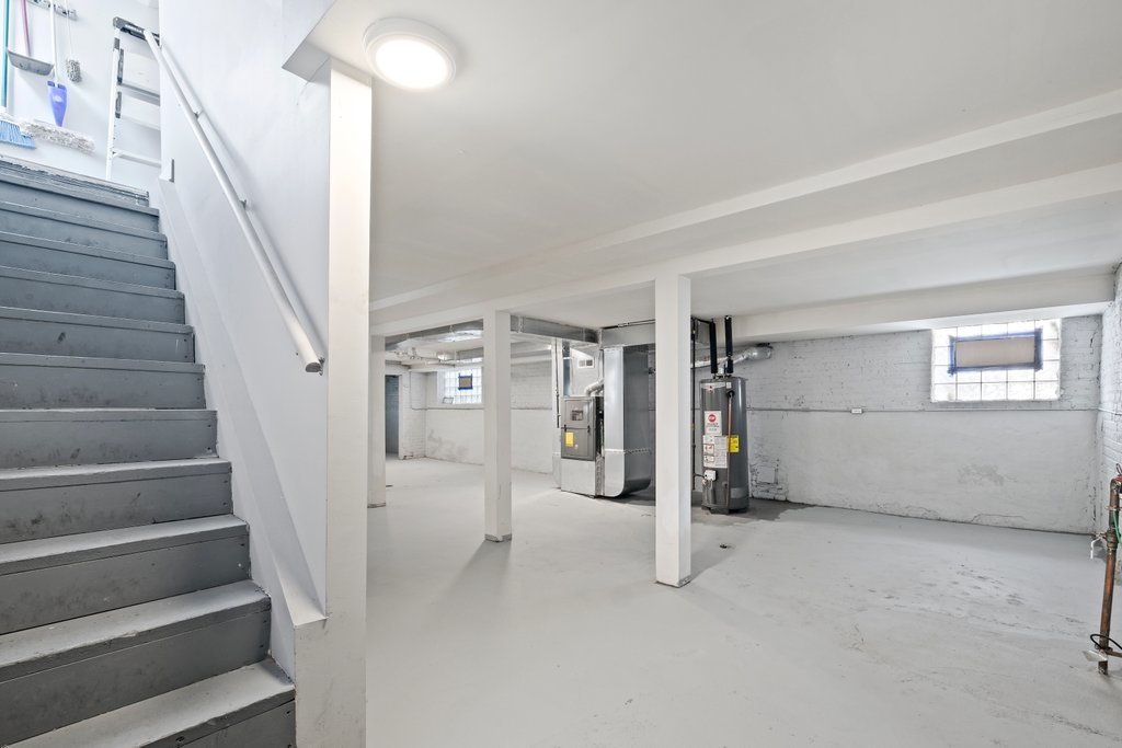 8014 South May Street Chicago, IL 60620 - Photo 39 of 50 a view of an empty room with stairs