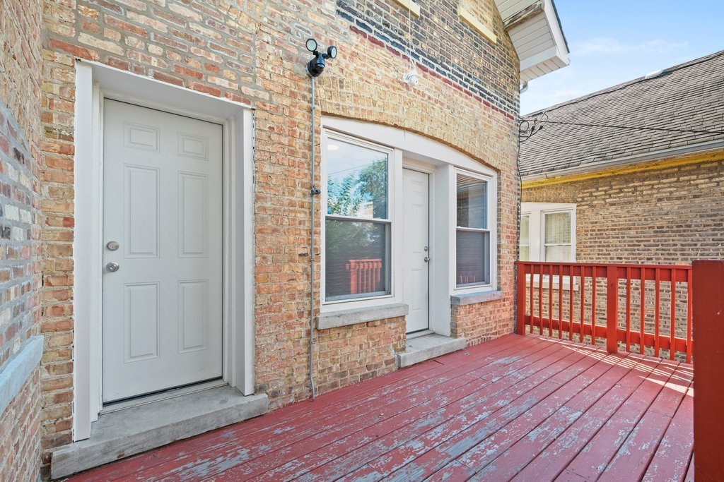 8014 South May Street Chicago, IL 60620 - Photo 44 of 50 an empty room with wooden floor and windows
