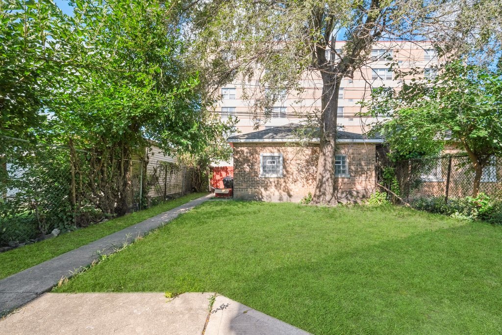 8014 South May Street Chicago, IL 60620 - Photo 49 of 50 a view of a house with a yard