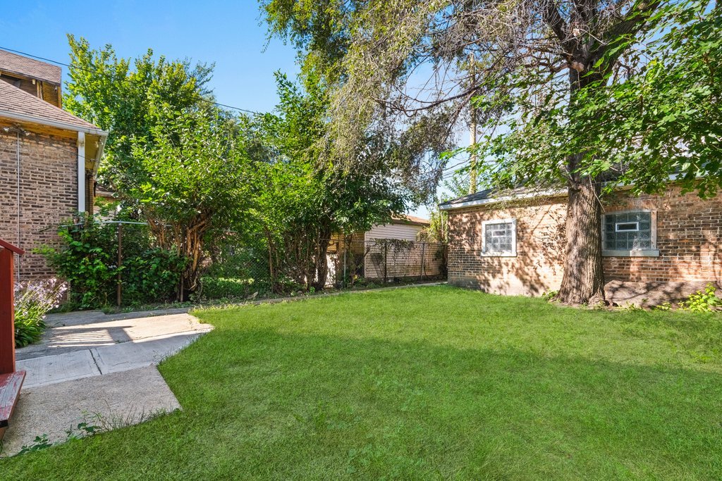 8014 South May Street Chicago, IL 60620 - Photo 50 of 50 a view of a house with backyard and garden