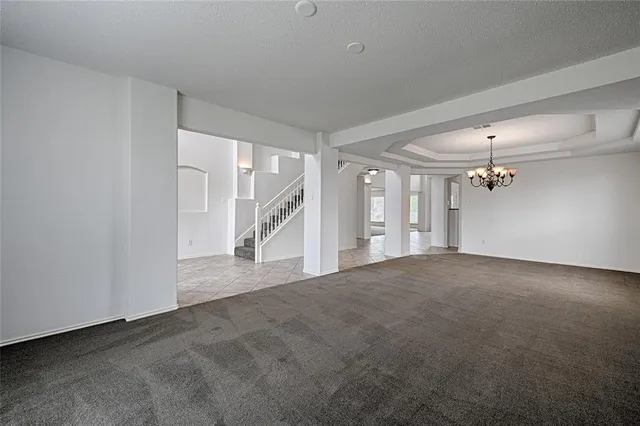 a view of a big room with closet and windows