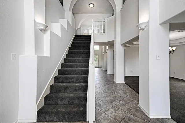 a view of entryway and hall with a dining room