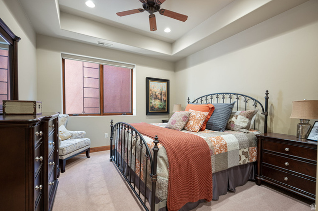 2331 West Entrada Trail, Unit 61 St. George, UT 84770 - Photo 33 of 69 Recessed lighting illuminates a tray ceiling and a ceiling fan with wood-finish blades
