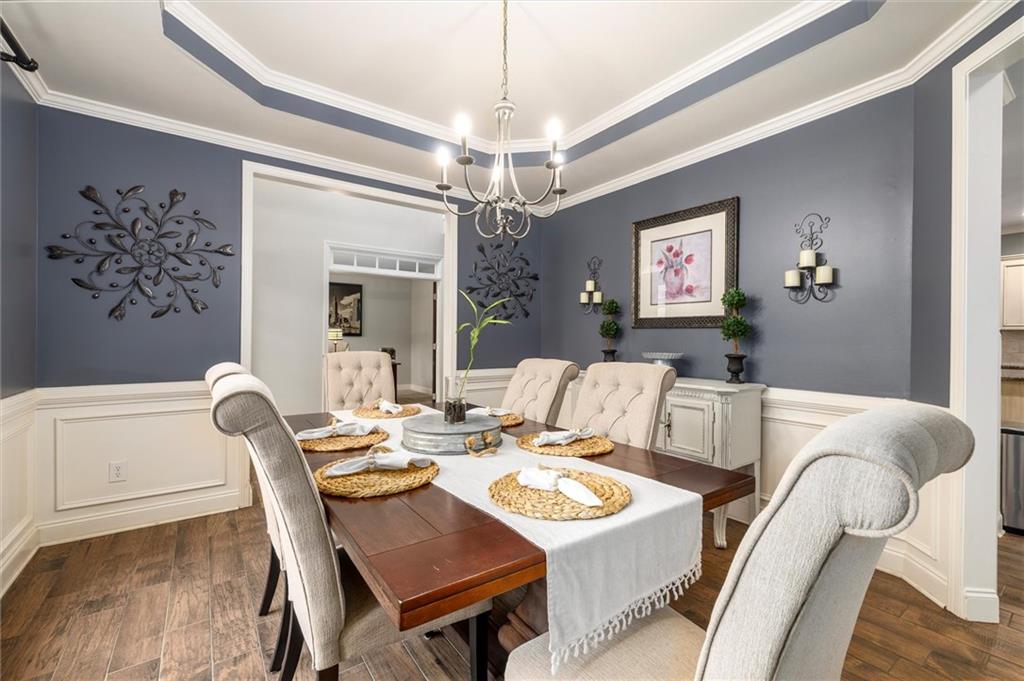 2016 Portage Point Southeast Lawrenceville, GA 30045 - Photo 16 of 44 a view of a dining room with furniture wooden floor and chandelier