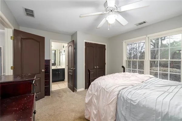 a bedroom with a bed and window