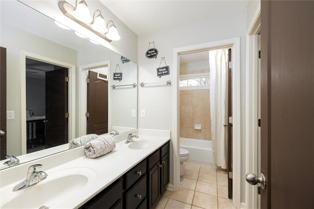 2016 Portage Point Southeast Lawrenceville, GA 30045 - Photo 26 of 44 a bathroom with a sink double vanity and a mirror