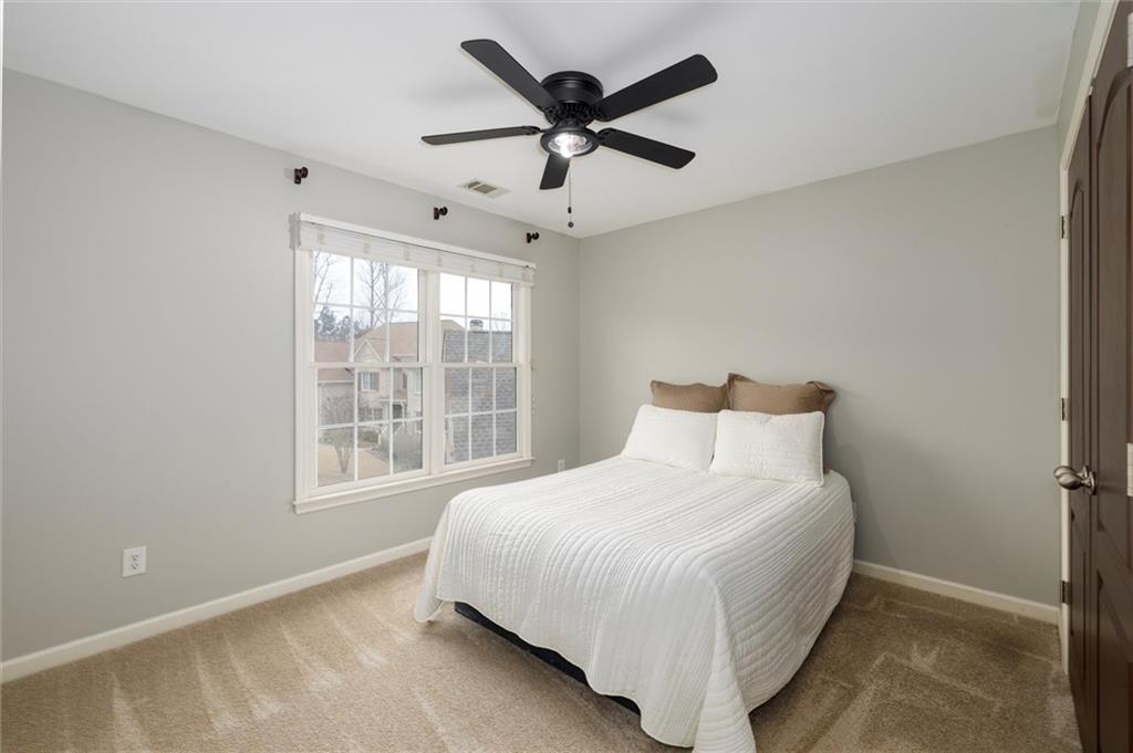 2016 Portage Point Southeast Lawrenceville, GA 30045 - Photo 27 of 44 a bedroom with a bed and window