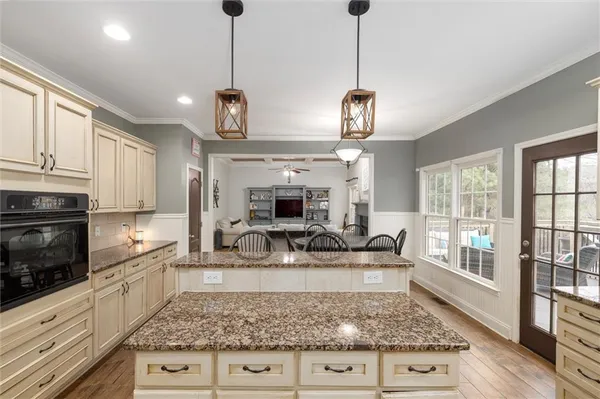 a view of living room with granite countertop furniture and fireplace