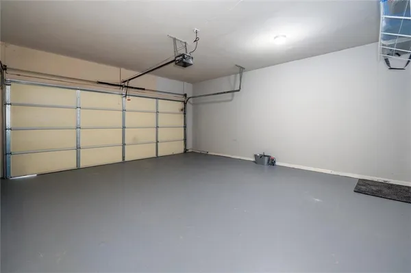 a view of a room with furniture and hardwood floor