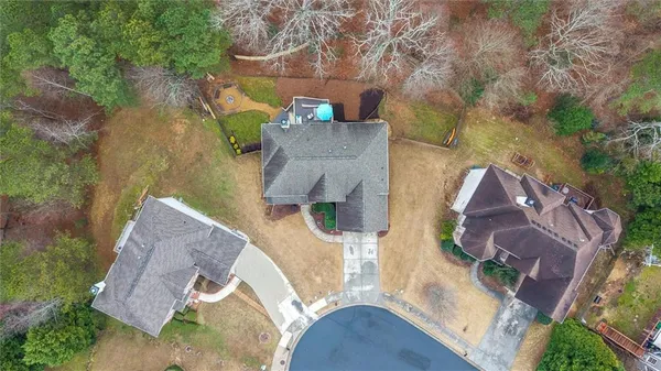an aerial view of a house with outdoor space