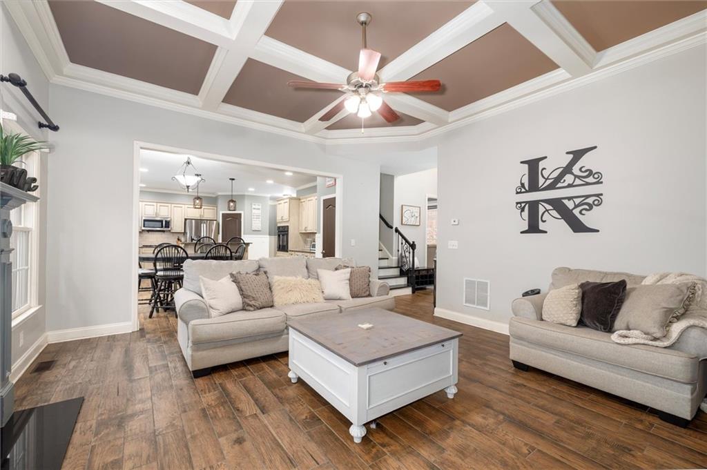 2016 Portage Point Southeast Lawrenceville, GA 30045 - Photo 7 of 44 a living room with furniture and a chandelier