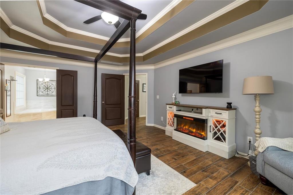 2016 Portage Point Southeast Lawrenceville, GA 30045 - Photo 10 of 44 a living room with furniture a fireplace and a flat screen tv