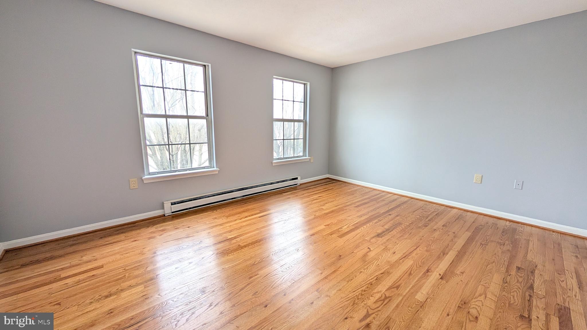354 Valley Mill Road Winchester, VA 22602 - Photo 12 of 34 an empty room with wooden floor and windows