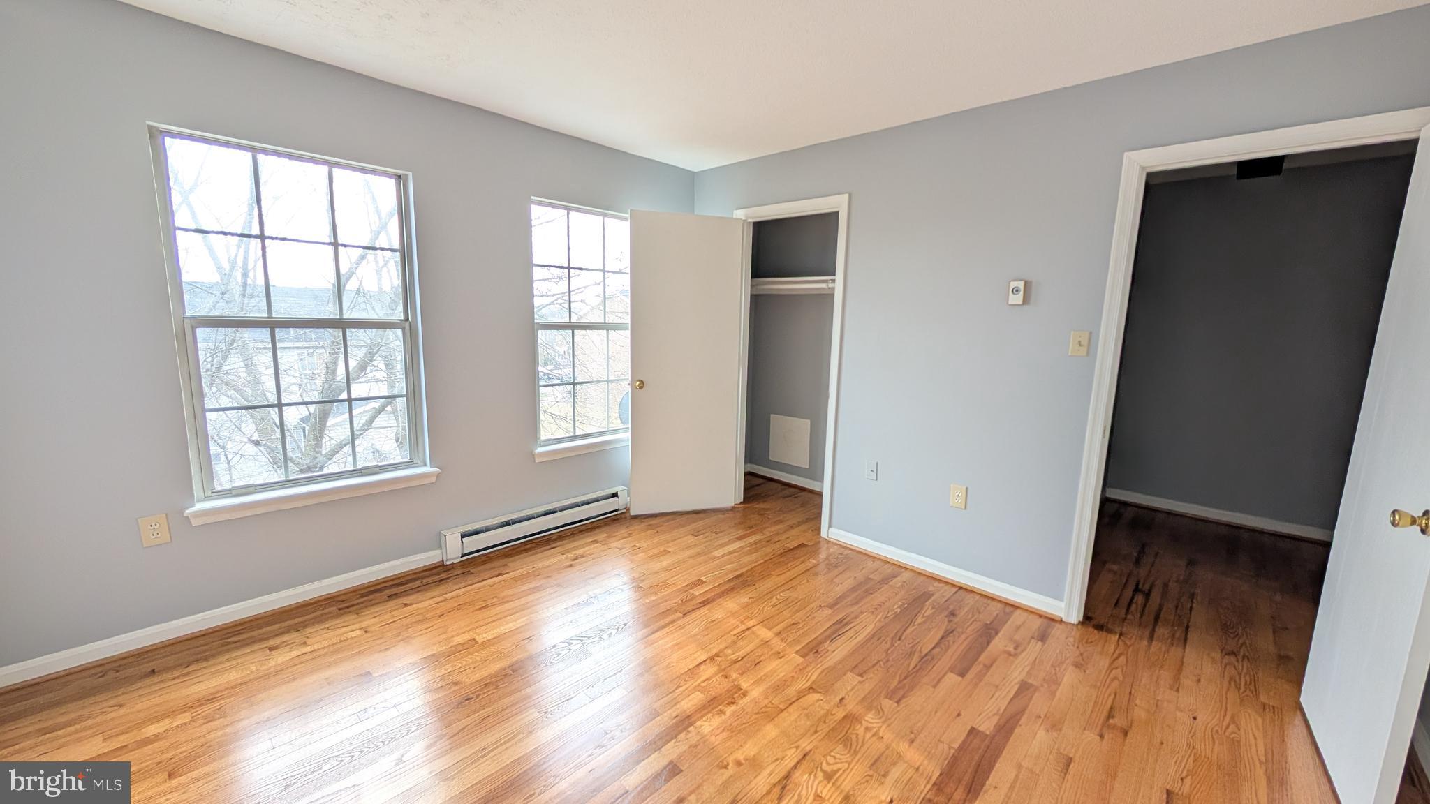 354 Valley Mill Road Winchester, VA 22602 - Photo 18 of 34 an empty room with wooden floor and windows