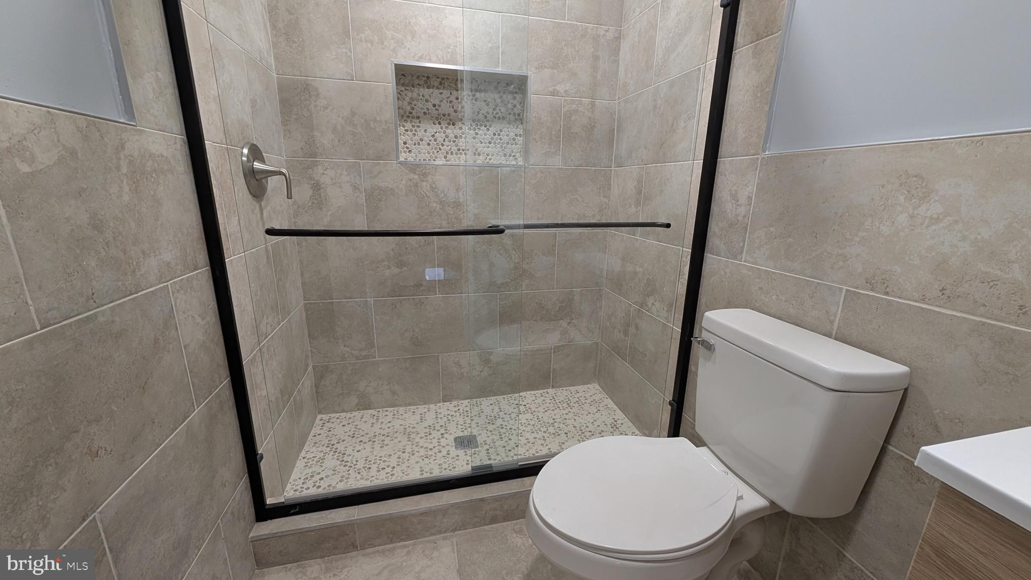 354 Valley Mill Road Winchester, VA 22602 - Photo 29 of 34 a white toilet sitting next to a shower