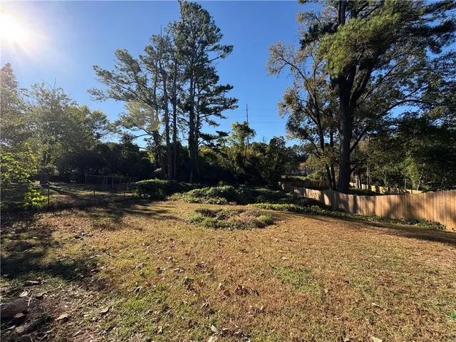 a view of a yard with trees