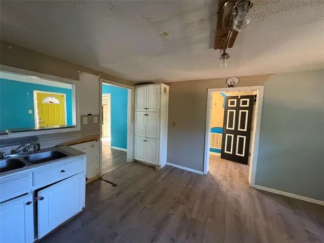 a view of hallway with wooden floor
