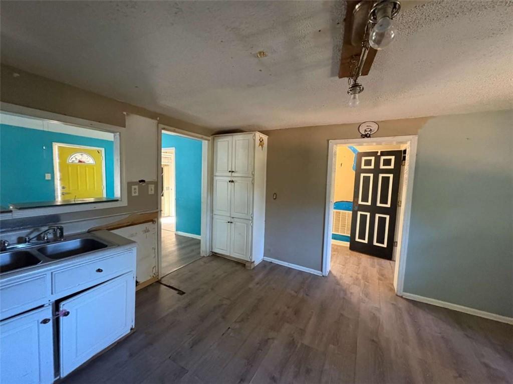 267 East Broad Street Newnan, GA 30263 - Photo 4 of 15 a view of hallway with wooden floor
