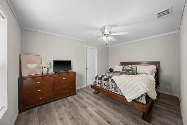 a room with a sink and wooden washer