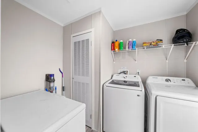 a bathroom with a granite countertop sink toilet and a mirror