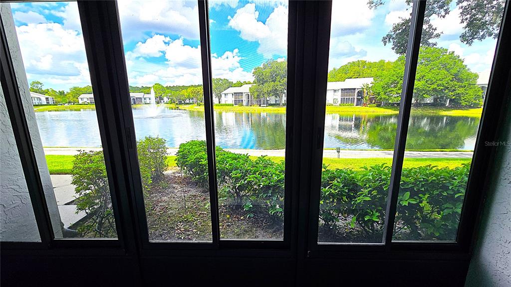 1109 Pine Ridge Circle West, Unit C1 Tarpon Springs, FL 34688 - Photo 11 of 50 a view of an outdoor from a window