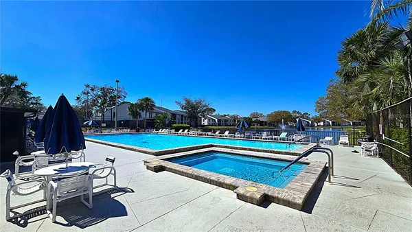 a view of swimming pool with chairs