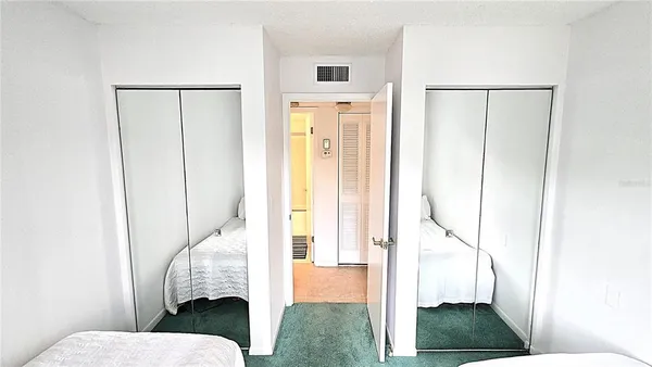 a bathroom with a sink and mirror with toilet