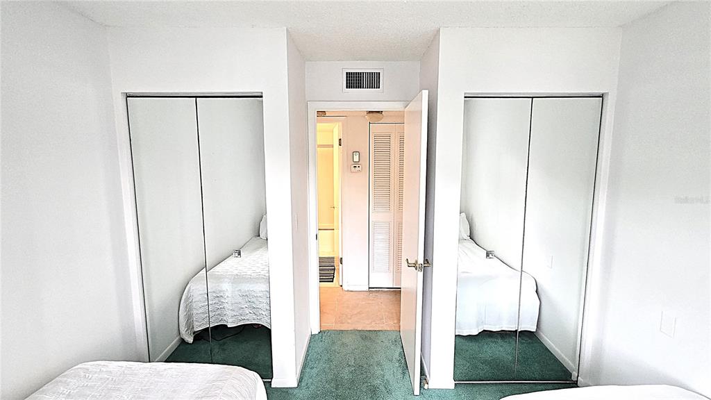 1109 Pine Ridge Circle West, Unit C1 Tarpon Springs, FL 34688 - Photo 31 of 50 a bathroom with a sink and mirror with toilet