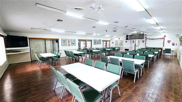 a view of a dining area with furniture window and wooden floor