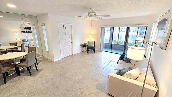 a living room with furniture and a table