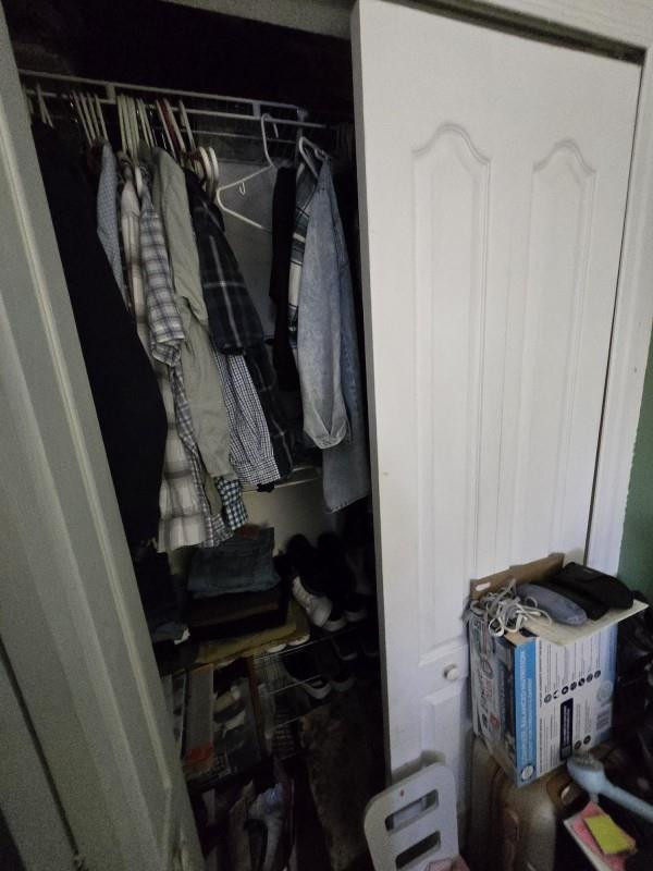 8930 West Flagler Street, Unit 221 Miami, FL 33174 - Photo 11 of 16 a view of walk in closet with clothes and shoes